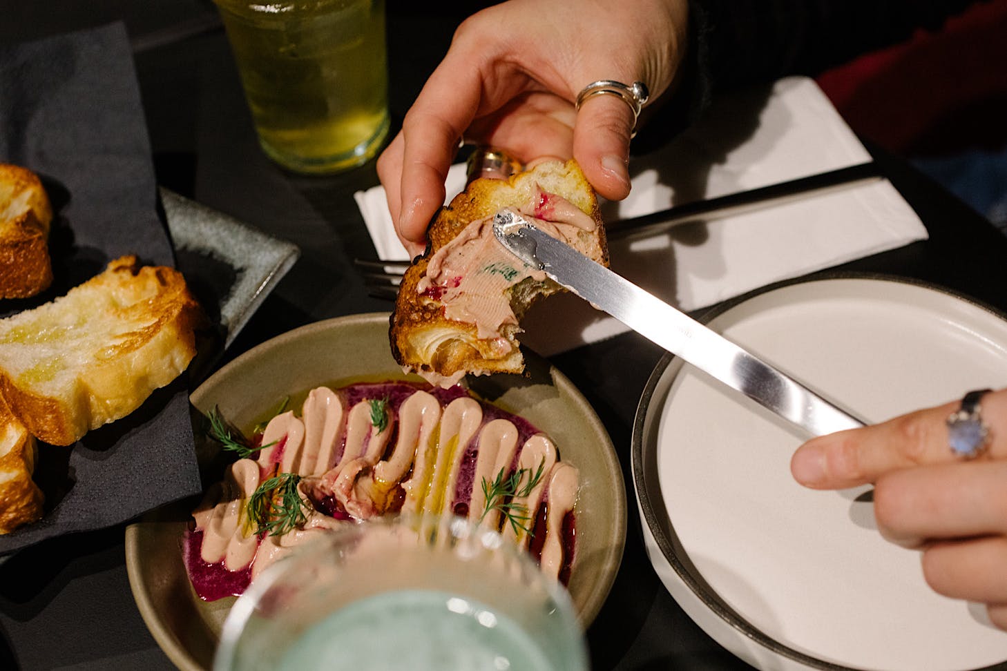 Vicki spreads pate on fluffy toast at truth/dare.